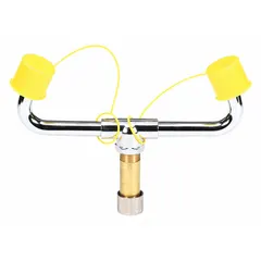 Brass spray head yoke with dust covers for Classic eyewash series. Includes supply stem with gray NPT connection. Compatible with eyewash head part S19-210B. Used as a replacement component in eyewash stations for safety applications.
