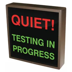 Backlit safety sign displaying 'Quiet! Testing In Progress' for visibility in low-light conditions. Used in industrial and laboratory environments to indicate ongoing testing and the need for quiet, supporting workplace safety protocols.
