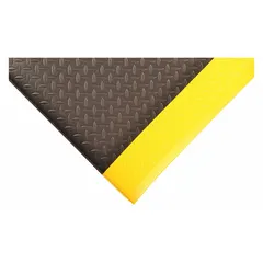 This wear-resistant antifatigue mat measures 4 ft by 60 ft with a 1/2 in thickness. Constructed from PVC foam in black with a yellow border, it includes an anti-slip backing. Suitable for industrial workstations, assembly lines, and high-traffic areas to reduce worker fatigue and provide slip resistance.