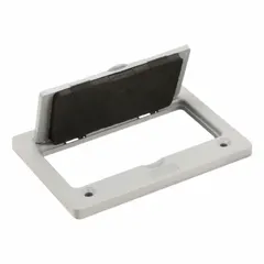 This nonmetallic floor box cover is made of gray ABS with a smooth finish. It is designed to protect and conceal electrical outlets, data ports, or low-voltage connections in commercial and industrial flooring applications.