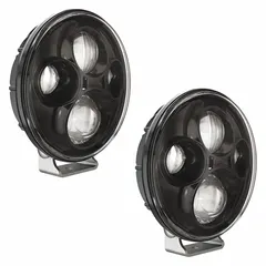 This J.W. SPEAKER TS4000 is a round, trapezoid-shaped LED work light with a black housing. It features a pedestal mount and DT04-2P connector for removable surface-mount installation. Suitable for vehicle-mounted illumination in industrial, construction, and maintenance settings.