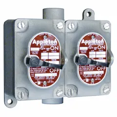 Two-gang front lever tumbler switch with 3-way switching, rated 20 A at 277 V AC. Features a feed-thru hub with 1/2 in hub size for conduit connections. Suitable for industrial lighting and motor control applications requiring manual operation in confined spaces.