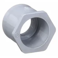 PVC reducer fitting for transitioning from 2-inch to 1-1/2-inch trade size in rigid PVC conduit systems. Used in electrical installations to connect different conduit diameters, ensuring a secure fit in conduit runs