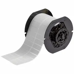 Precut label roll measuring 1 1/2 in x 1/2 in, made of gray metalized polyester. Halogen-free material suitable for industrial identification and labeling applications. Compatible with Brady i3300 printer series for on-demand printing.
