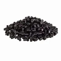 ABS-CF 3D-printing pellets in black color, supplied in 25 kg bags. Durometer of 100 Shore D. Used in industrial additive manufacturing for producing strong, rigid parts such as functional prototypes, tooling, and end-use components requiring carbon-fiber reinforcement