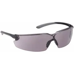 Frameless safety glasses with padded comfort-fit design. Gray lenses reduce glare; anti-fog and scratch-resistant coatings maintain clear vision. Dielectric construction provides electrical insulation. Suitable for industrial environments requiring impact protection, such as electrical work, machining, and general plant maintenance.