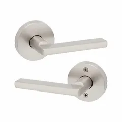 This storeroom lever lockset features a satin nickel-plated zinc finish and a rose style trim. It is ADA compliant and designed for ANSI F75 Hall function, allowing key entry from outside and free egress from inside. Suitable for commercial applications such as storage rooms, utility closets, or back-of-house areas where secure access control is required.