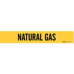 Yellow adhesive pipe marker with black legend reading 'Natural Gas'. Fits pipe outer diameters from 2-1/2 to 7-7/8 inches. Supplied without directional arrows. Used for identifying natural gas lines in industrial piping systems.
