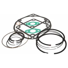 Replacement ring and gasket kit for small reciprocating compressors. Includes components with part numbers 1WF63 and 2545. Used to replace worn gaskets and rings to maintain sealing integrity and prevent air leaks.