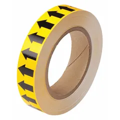 Yellow vinyl banding tape with black directional flow arrows for pipe marking. Non-reflective, 1 inch wide by 90 feet long. Applied to pipes to indicate flow direction and content, aiding in facility safety and identification.