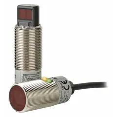 M18 threaded cylindrical photoelectric sensor with brass body and built-in 4-pin M12 connector. PNP output, 10-30V DC supply. Suitable for non-contact object detection in industrial automation applications such as packaging, material handling, and assembly lines.