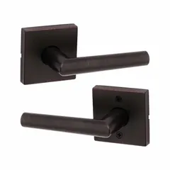 This storeroom lever lockset is designed for commercial doors requiring keyed entry from outside and free egress from inside, such as storage rooms or utility closets. It features a satin bronze-plated, blackened, satin relieved, clear coated zinc finish with a rose style. The ANSI F75 Hall function ensures security while the lever operation meets ADA compliance for accessibility.
