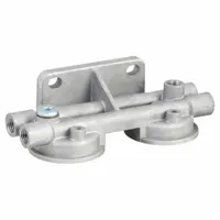 Coolant filter base designed to mount compatible coolant filters in industrial filtration systems. Measures 8 3/16 inches in length and includes two brass plugs for installation
