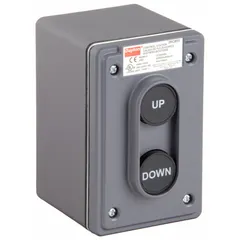 This push-button control station features two black operators with Up/Down legend and 2NO contact configuration. It provides momentary control for raising/lowering or start/stop functions in industrial machinery such as hoists, conveyors, and lifts.