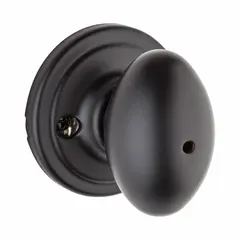 This privacy knob lockset is designed for interior doors requiring locking privacy, such as bathrooms or bedrooms. It features a push-button or turn-button lock on the inside and an emergency release on the outside. The Rose lockset style provides a clean appearance suitable for residential or light commercial applications.