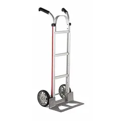 Flow-back hand truck with a 500 lb capacity. Silver aluminum frame resists corrosion. Rubber tread-on-core wheels provide traction. Suitable for moving loads in industrial, warehouse, and commercial environments.