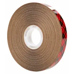 3M 969 is a reverse-wound adhesive transfer tape with a permanent acrylic adhesive on a transparent carrier. It is 1/2 inch wide, 36 yards long, and 5 mils thick, supplied in a 72-pack with a kraft paper liner. This tape is used for bonding applications such as mounting, splicing, and attaching nameplates, gaskets, or foam components in industrial assembly and fabrication.