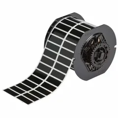 Thermal transfer precut label roll with rubber, permanent adhesive. Contains 3,300 labels, each 1/2 in x 1 1/2 in. Compatible with BBP33 printer series. Used for industrial identification, asset tracking, safety labeling, and cable marking.