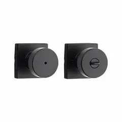 This privacy knob lockset is intended for interior doors requiring locking privacy, such as bathrooms or bedrooms. It features a push-button lock on the inside and an emergency release on the outside. The lockset has a Rose style design.