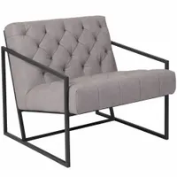 Accent chair with gray faux leather back, seat, and overall material. Overall width and height are 27 1/2 inches. Stationary design with no casters or glides. Suitable for seating in living rooms, lounges, or office reception areas