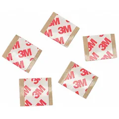 Double-sided tape with acrylic adhesive and polyester film backing, supplied as 1-inch pre-cut squares. 8.3 mil thickness. Used for bonding, mounting, splicing, gasketing, nameplate attachment, and electronic assembly where a thin, strong bond is required.