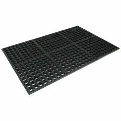 This standard drainage mat features a raised diamond stud surface made of black natural rubber. With a thickness of 7/8 in, it is designed for use in areas where drainage and traction are needed, such as wet or oily environments. The mat is non-reversible and suitable for standing work areas.
