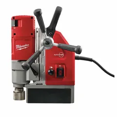 Compact magnetic drill press with electric magnet for securing to ferrous surfaces. Operates on 120V AC with 5-3/4 in drill travel. Suitable for drilling holes in steel beams, plates, and structural steel in construction, fabrication, and maintenance applications.
