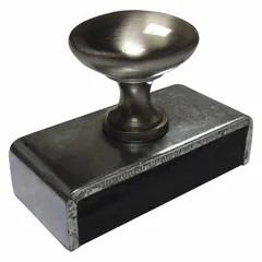 This holding-style ceramic magnet is encased with a handle for manual lifting and positioning of ferrous parts. With a thickness of 1.12 inches and an outside diameter of 1 1/8 inches, it provides a maximum pull force of 23 lbf. Suitable for light-duty fixturing, assembly, and retrieval tasks in industrial settings.