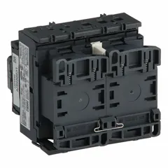 This reversing IEC contactor controls motor direction by swapping two phases. It has 3 poles and 3 normally open contacts, rated for 25 A with a 120V AC coil. No integrated surge suppression. Used in applications requiring forward/reverse operation such as conveyors, hoists, and pumps.
