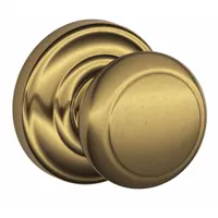 Passage knob lockset in the Andover style, constructed from brass. Designed for interior doors where locking is not required, such as hallways or closets, providing a non-latching function for commercial or residential applications