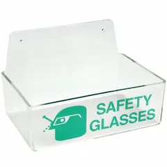 Wall-mounted tray for storing up to 4 pairs of safety glasses. Made of green plastic, with overall dimensions of 9 in width and 3 in height. Provides organized, accessible storage in industrial or laboratory settings.