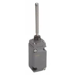 This coil-spring wobble-stick limit switch features two mounting holes and screw terminals for electrical connections. It is used in industrial machinery to detect the position or presence of objects, such as on conveyor systems, packaging equipment, and material handling lines.