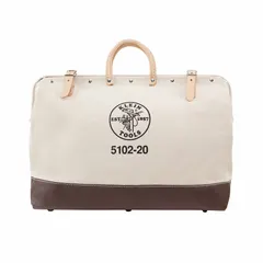 This brown canvas tool bag features a wide-mouth opening for easy access. It includes one exterior pocket and one inside pocket for organizing hand tools, meters, and small parts. Suitable for carrying tools on job sites.