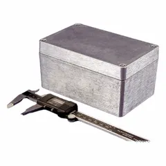This die-cast aluminum enclosure measures 6 in x 3 in x 3 in and features a solid screw-on cover. It is rated NEMA 1/12/13/4/4X for protection against dust, water, and corrosion, making it suitable for indoor and outdoor applications. The enclosure uses screws for closure and does not include knockouts.