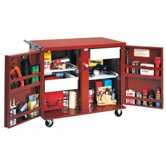 This fully assembled mobile cabinet bench features a steel construction with a brown finish. It includes drawers and shelves for organized storage, and a handle on the side for easy repositioning. Suitable for use in workshops, garages, and industrial settings as a workbench and storage unit.