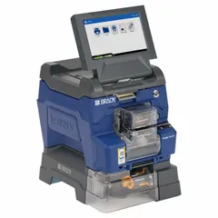Wraparound label printer and applicator with 300 dpi auto printhead resolution, capable of up to 1,000 labels per day. Includes Brady Workstation Product and Wire ID Software Suite, USB cable, and a 1.25 in roll of vinyl clear/white labels. Suitable for industrial wire and cable identification, panel marking, and equipment labeling.