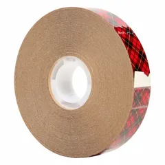 This reverse-wound adhesive transfer tape features a permanent acrylic adhesive that is transparent and UV-resistant, with a thickness of 2 mil. It is supplied on a kraft paper liner and measures 60 yards in length. Commonly used for mounting, splicing, and laminating applications where a clear, durable bond is required.