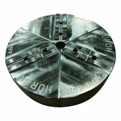 Full-grip lathe jaw with round tongue and groove design, constructed from aluminum. Designed for use with a 12-inch chuck and features a 2-inch height. Mounting bolt size is 1/2 inch. Suitable for gripping workpieces during machining operations in metalworking and industrial manufacturing.