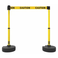This retractable belt barrier system includes two round flat posts with bases and a 15-foot yellow belt printed with a caution message. Designed for pedestrian guidance and area delineation, it helps manage foot traffic and restrict access in industrial facilities, warehouses, and public spaces.