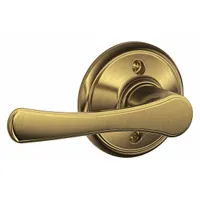 This SCHLAGE privacy lever lockset features an Avila style lever and is constructed of brass with a satin brass, blackened, satin relieved, clear coated finish. It is ADA compliant and designed for interior doors requiring privacy, such as bathrooms or bedrooms. The lockset is not ligature-resistant and has no visual indicator message