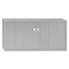 Vertical multi-unit mailbox with 7 lockable front-access doors. Surface-mount design for organized mail collection in multi-tenant settings. Dimensions: 19 in H x 40 3/4 in W x 7 1/2 in D.