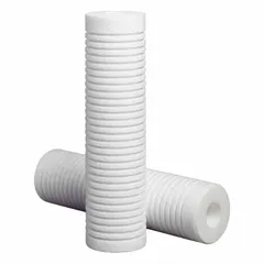 Solid water filter cartridge with string-wound polypropylene media for sediment filtration. Removes particulates to protect downstream equipment in industrial and commercial water systems. 13 micron rating, 5 1/2 inch overall height.