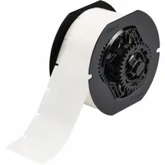 Thermal transfer precut label roll made of clear, gloss-finished autoclavable polyester. Each label measures 2 inches wide by 1 inch high, with a 1-inch roll length. Compatible with BBP33 printer series. Suitable for industrial labeling in environments requiring sterilization, such as medical, laboratory, and pharmaceutical asset tracking.