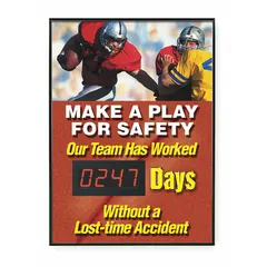 Electronic scoreboard constructed of aluminum with mounting holes for wall installation. Displays the message 'Our Team Has Worked ___ Days Without A Lost Time Accident' to track accident-free days. Operates on 110/120V AC power and is controlled via remote control. Nominal sign size is 28 in x 20 in. Not retroreflective.