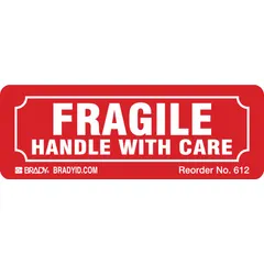 Red background label measuring 1 1/8 by 3 1/4 inches, printed with 'Fragile Handle with Care' message. Supplied in a 500-pack for marking delicate shipments that require careful handling during transit or storage.