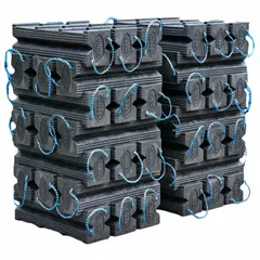 Plastic cribbing block set, 42 pieces, each 24 in long, black, rectangular. Rated for 60 ton vertical load capacity. Used for supporting heavy machinery, structural shoring, and vehicle stabilization in industrial settings.