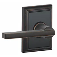 This SCHLAGE passage lever lockset features a Latitude style lever in an Aged Bronze and Brass finish. Designed for interior doors where locking is not required, such as hallways or closets, it allows free egress from both sides. The ANSI F75 function is suitable for light-commercial or residential applications needing a non-locking lever handle