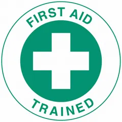 2-inch diameter, non-reflective, English-language circle label for hard hats. Identifies the wearer as First Aid Trained. Supplied in a standard 4-pack. Suitable for use in industrial environments where quick visual recognition of trained personnel is required.