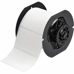 Thermal transfer precut label roll with rubber, permanent adhesive. Each roll contains 500 labels sized 2 in x 3 in. Compatible with Brady BBP33 and i3300 printer series. Used for industrial identification and labeling in environments requiring durable adhesion.
