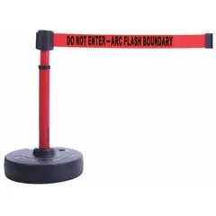 This retractable belt barrier post features a red post and belt with a black base, displaying the legend 'Do Not Enter - Arc Flash Boundary'. It is used to cordon off arc flash boundaries in industrial facilities, clearly marking restricted electrical safety zones to prevent unauthorized access during maintenance or live-work operations.